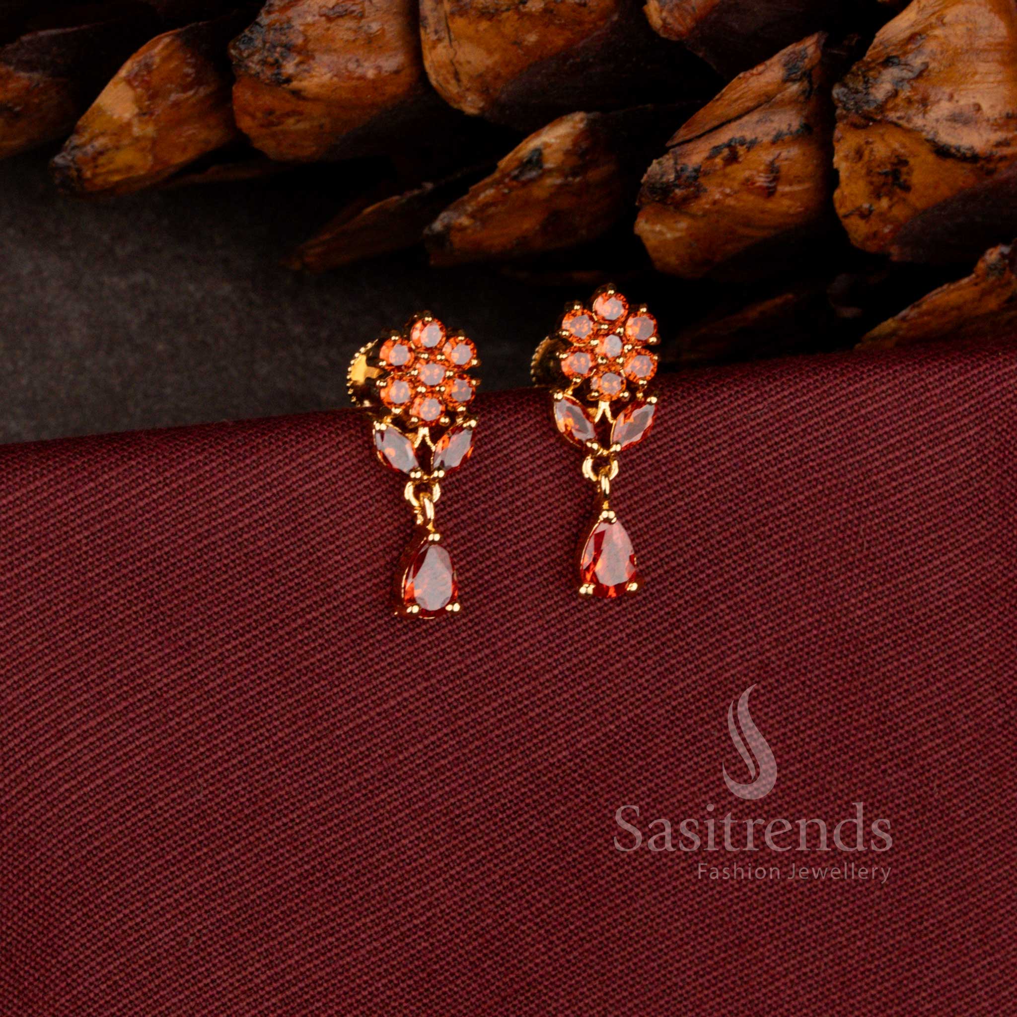Sasitrends premium micro gold plated dangler earrings adorned with a brilliant teardrop AD stone stud and rich polished finish perfect for bridal and grand celebration wear.