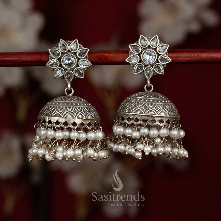 Ivory heritage oxidised silver white dome jhumkas with ornate floral stones and pearl cascades for celebration - jewellery - Sasitrends