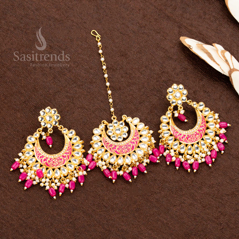 Traditional gold plated colourful painted tikka and earrings set, featuring blush pink stone embellishments, delicate bead drops, and floral engravings, perfect for a soft ethnic jewellery look - Sasitrends
