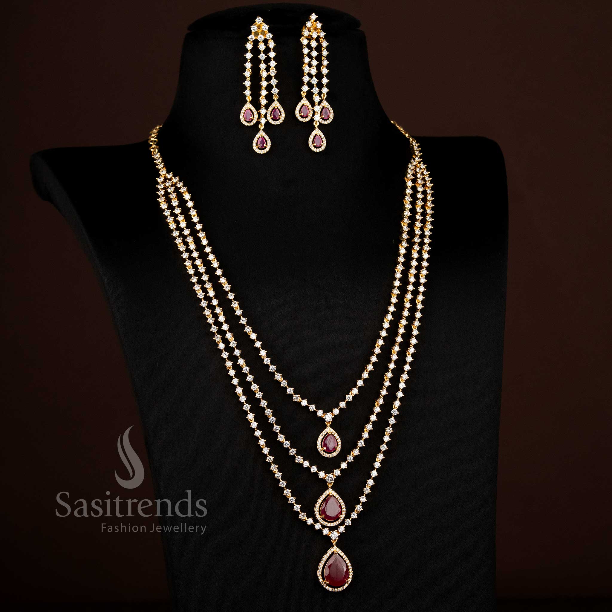 Majestic white-ruby American diamond micro gold plated three layer teardrop stone long necklace jewellery set radiating festive elegance – Sasitrends