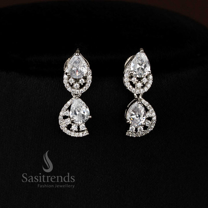 Stylish pink dual finish rhodium silver stud earrings with infinity pattern American diamonds for modern style - Sasitrends