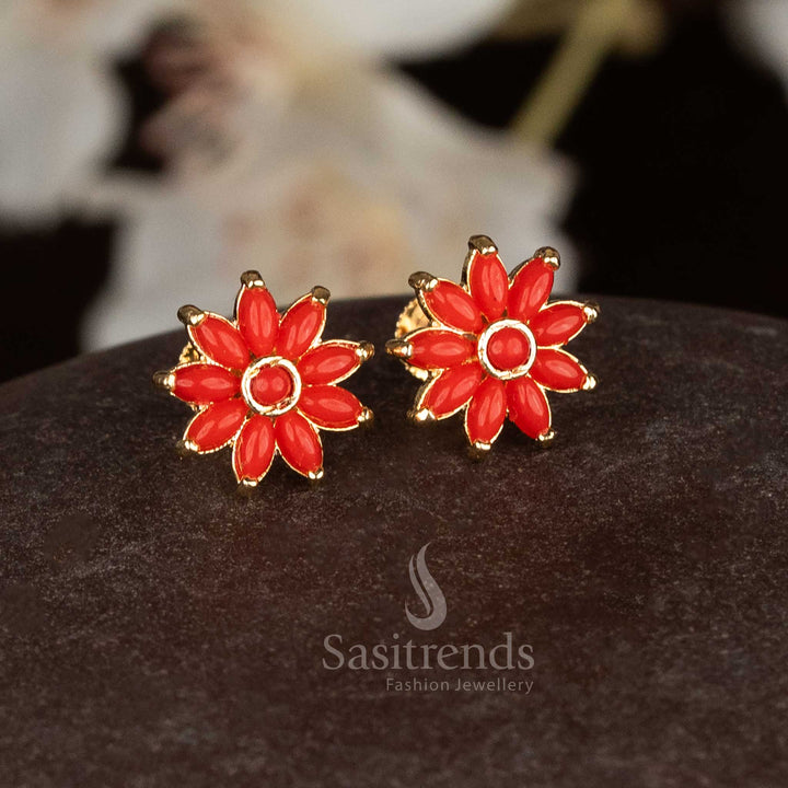 Fiery micro gold daisy flower screw stud earrings with red Pavalam gems for traditional ethnic occasions - Sasitrends