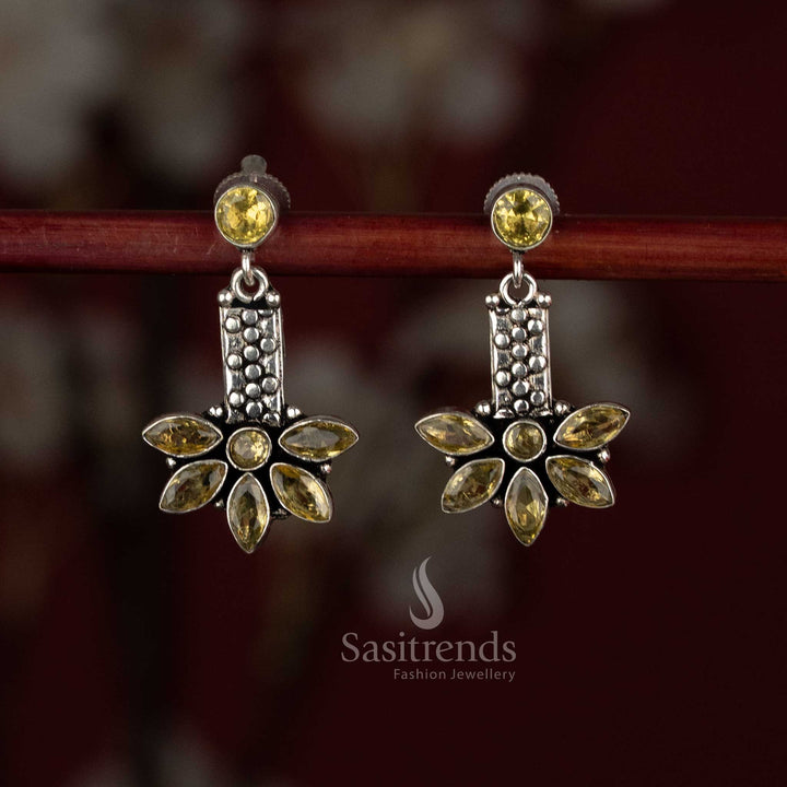 Warm yellow shade oxidised silver earrings with round cap element and leaf-detailed elongated charm – Sasitrends