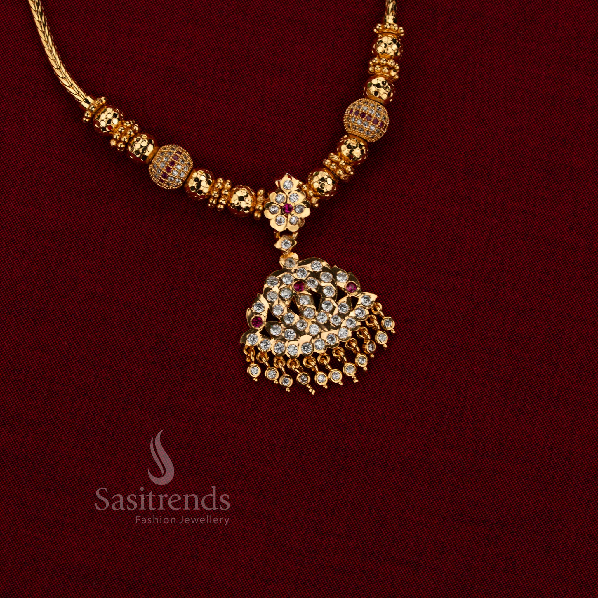 Radiant bell impon attigai micro gold plated AD stone golden ball chain necklace white ruby with guaranteed one gram and 24 carat gold look for weddings and festive wear – Sasitrends