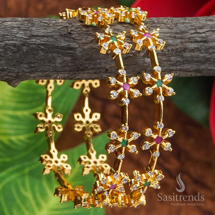 Stunning multi colour ruby green stone flower motif bangles pair in micro gold plating, beautifully highlighted with sparkling American Diamond details - Sasitrends