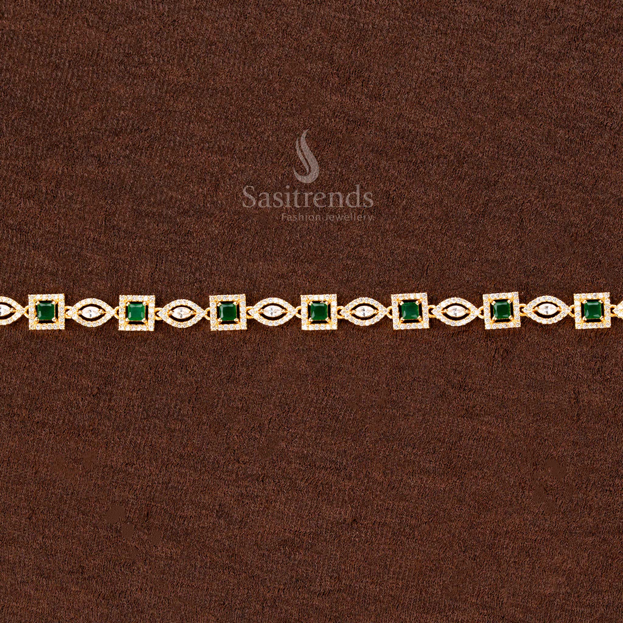 Emerald green gold-plated waist chain adorned with shimmering American diamonds, an intricate square and navette stone design, and a regal finish—perfect for weddings and bridal fashion - Sasitrends