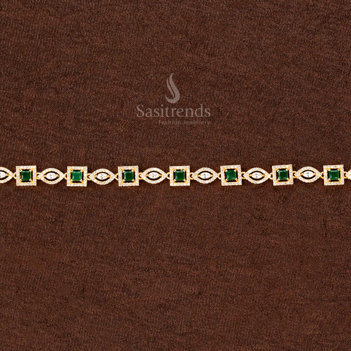 Emerald green gold-plated waist chain adorned with shimmering American diamonds, an intricate square and navette stone design, and a regal finish—perfect for weddings and bridal fashion - Sasitrends