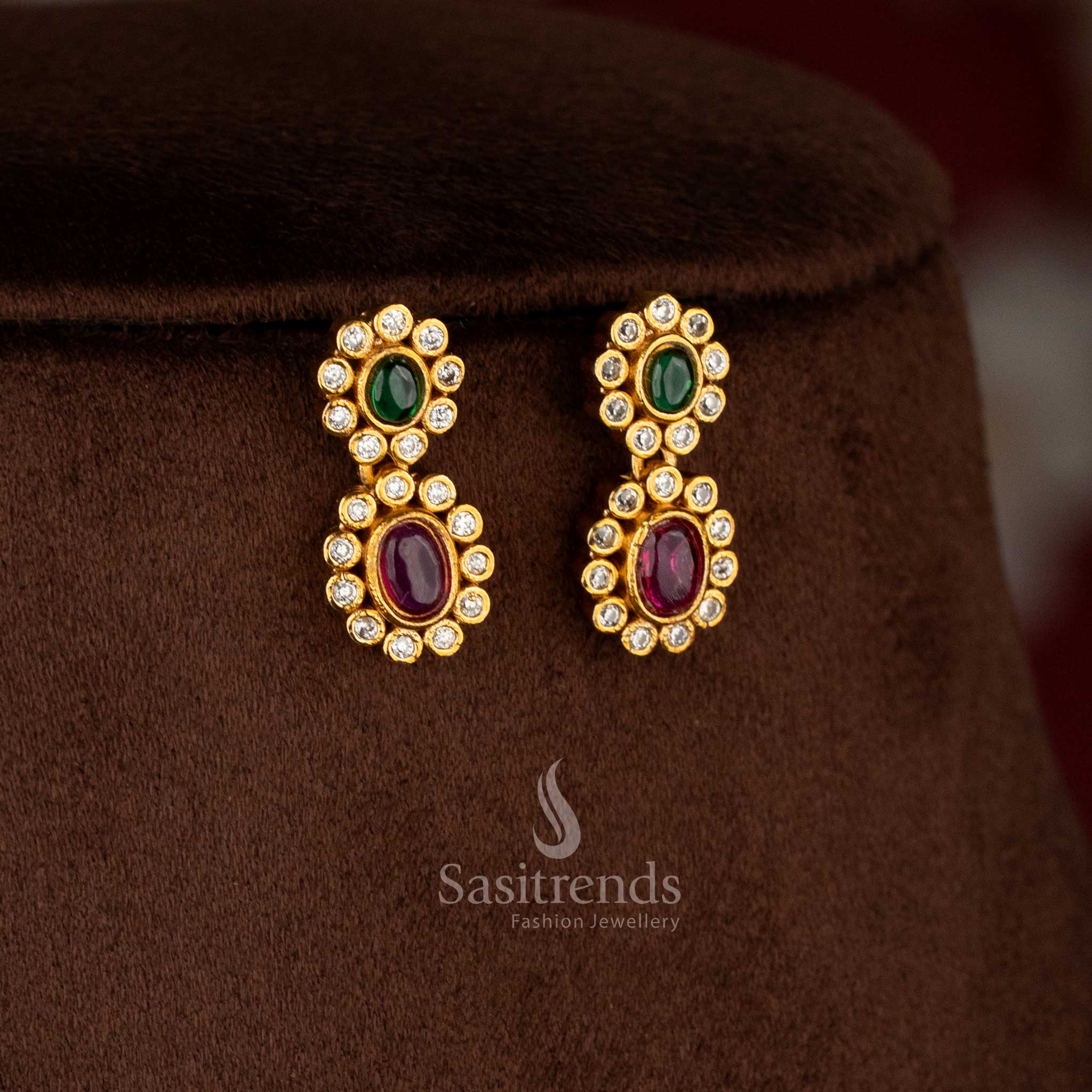 Charming matte gold plated ruby-green oval floral AD earrings for festive sarees, party occasions, and elegant styling – Sasitrends
