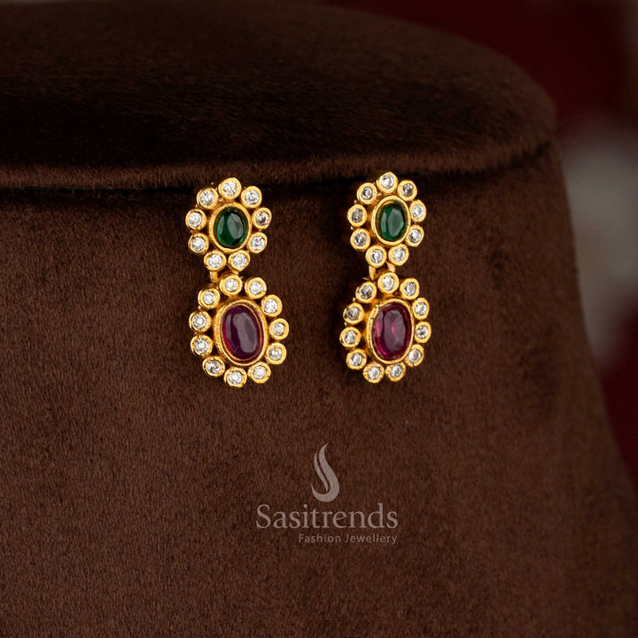 Charming matte gold plated ruby-green oval floral AD earrings for festive sarees, party occasions, and elegant styling – Sasitrends