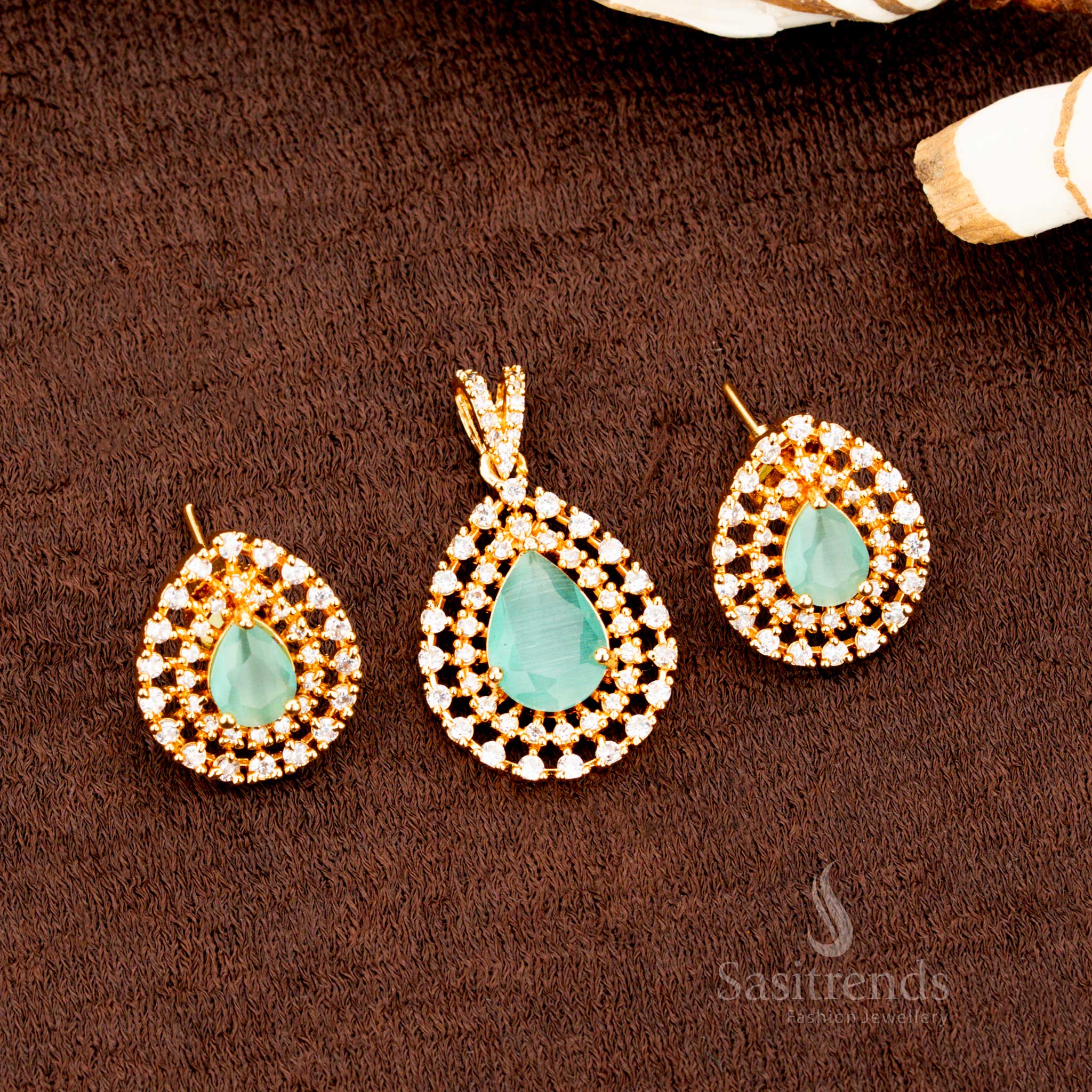 Charming micro gold plated teardrop pendant set featuring refreshing mint AD stones, a stylish jewellery piece for festive occasions, saree styling, and cultural events - Sasitrends