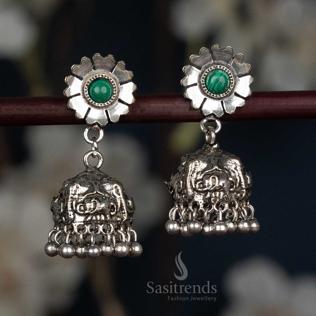 Artistic Oxidised Silver Floral Stud Jhumka Earrings Featuring Elephant Motif Dome And Dark Green Bead Accents, Designed For Women’s Festive And Cultural Styling – Sasitrends
