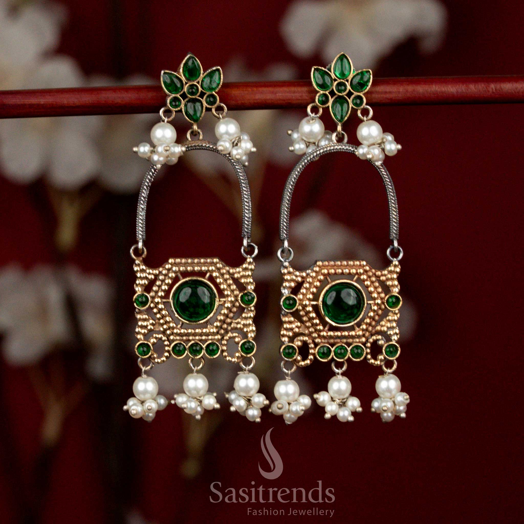 Refined antique oxidised silver earrings featuring green Monalisa stones, elegant floral arch motifs and pearl cluster drops for sophisticated party styling - Sasitrends