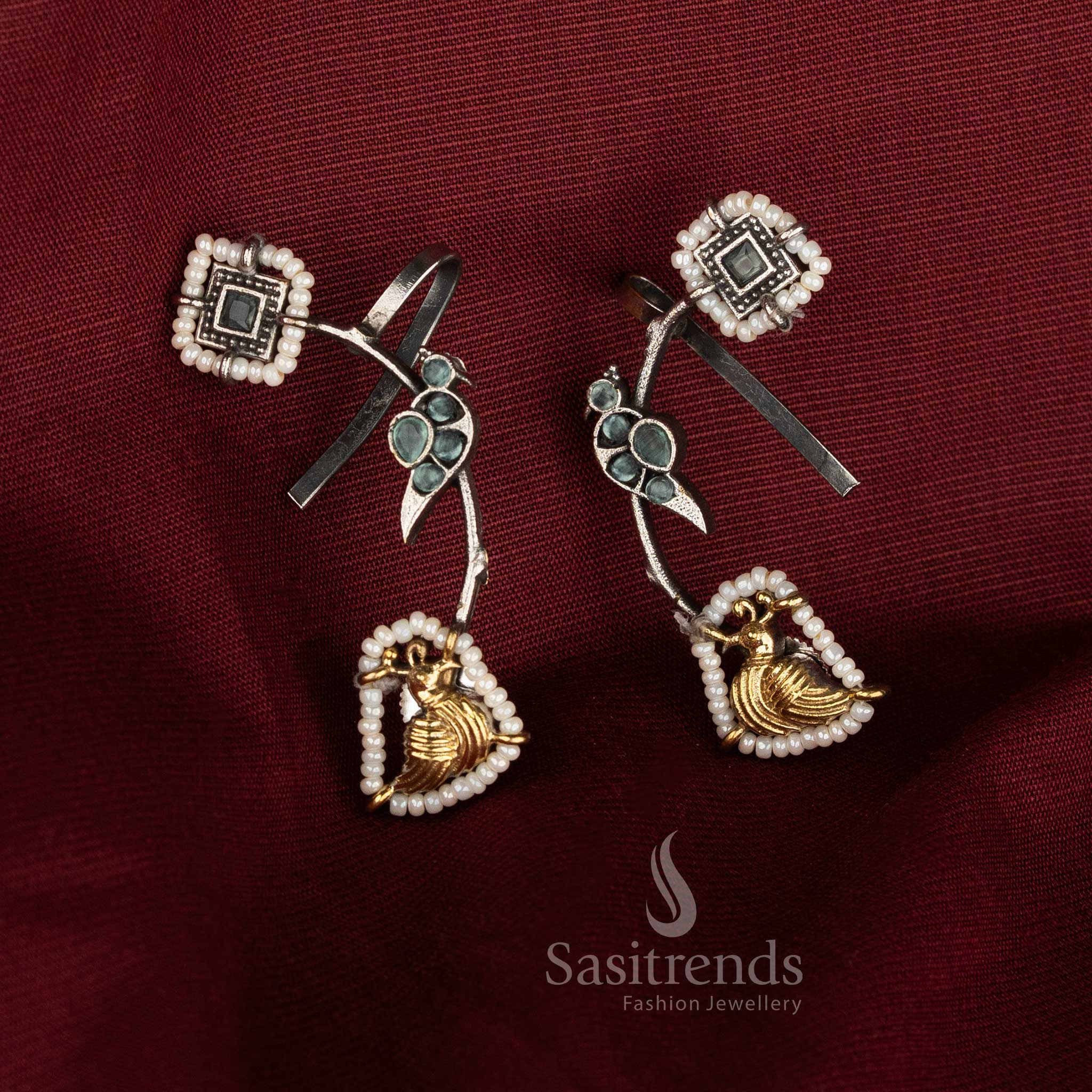 Attractive antique dual tone 92.5 silver oxidised ear cuff earrings featuring mint Monalisa stones, detailed peacock motif and artistic sculpting for refined ethnic styling - Sasitrends