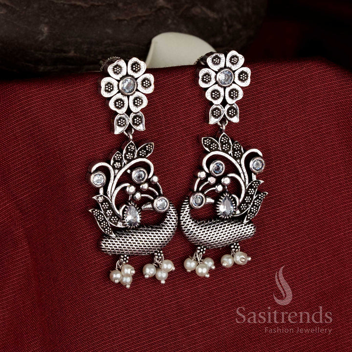 Charming oxidised silver floral peacock pearl drop earrings in white for Navarathri devotional jewellery - Sasitrends
