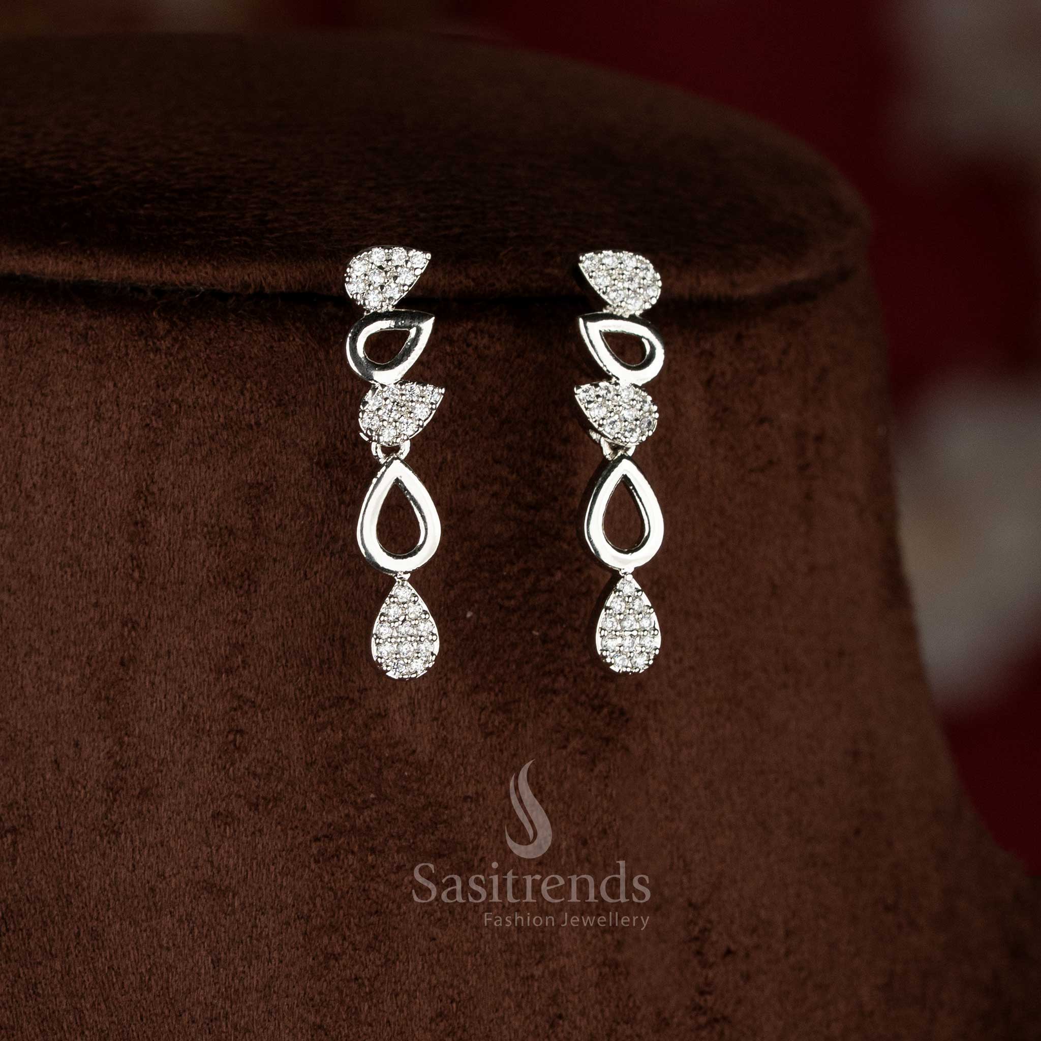Charming party wear American diamond rhodium silver plated white teardrop earrings for festive and party saree styling – Sasitrends