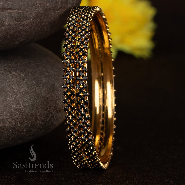 Antique inspired micro gold bangles with glossy black stones and detailed tribal motif jewellery perfect for celebrations - Sasitrends