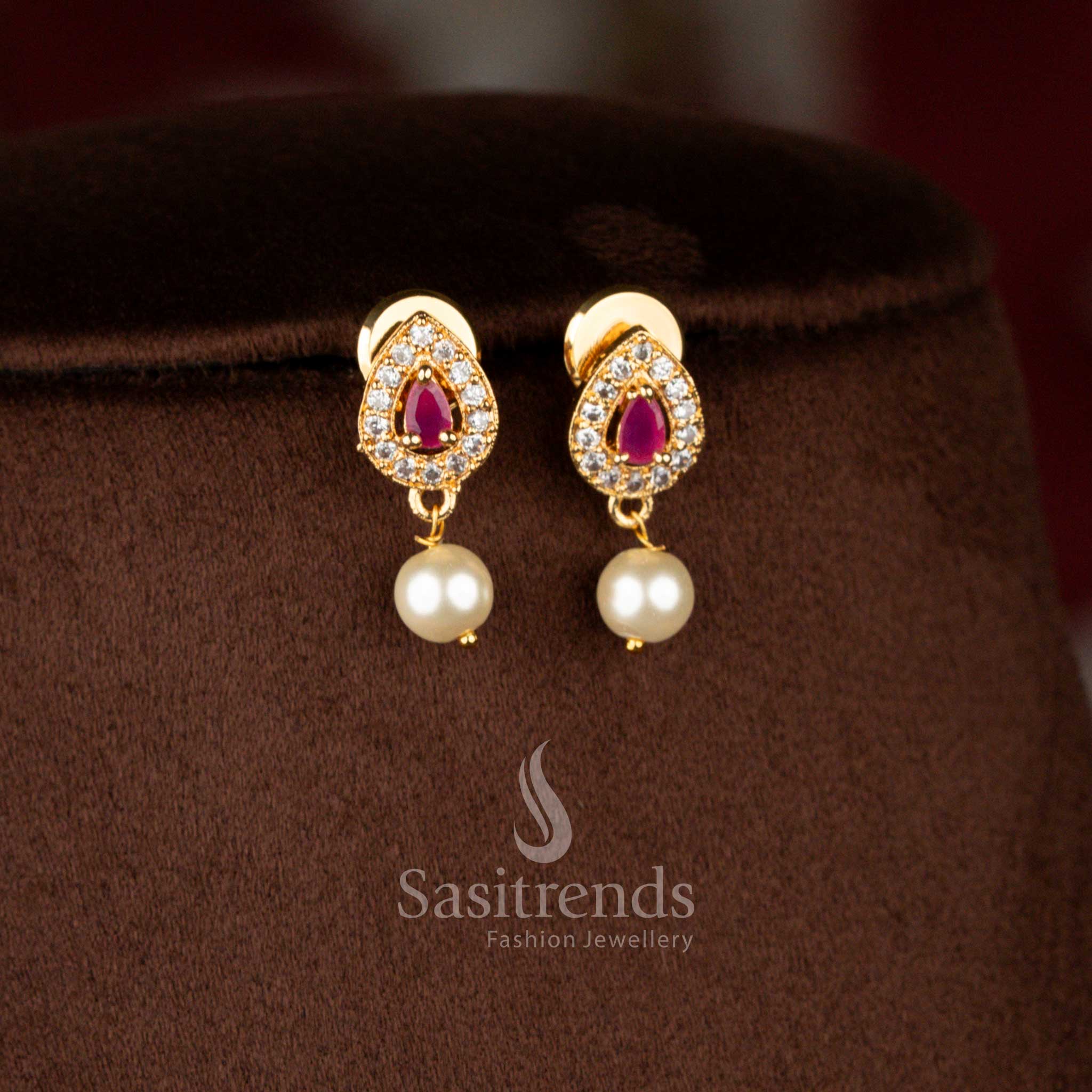 Elegant micro gold plated peacock dangle earrings in white-ruby with pear stone and pearl detailing, paired with necklace – Sasitrends