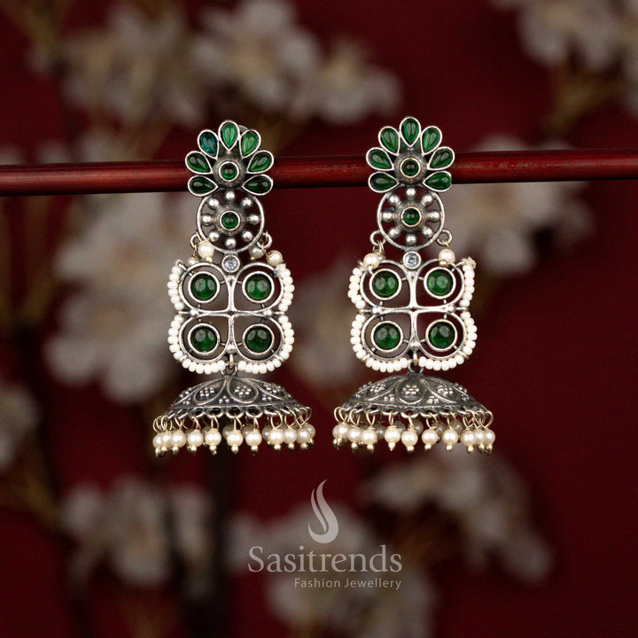 Regal oxidised floral geometric jhumka earrings adorned with green stones and pearl bells perfect for festive gatherings and cultural attire – Sasitrends