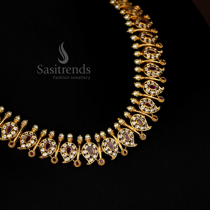 Traditional matte gold temple necklace set featuring intricate white ruby mango and stick designs with dazzling AD stones - Sasitrends