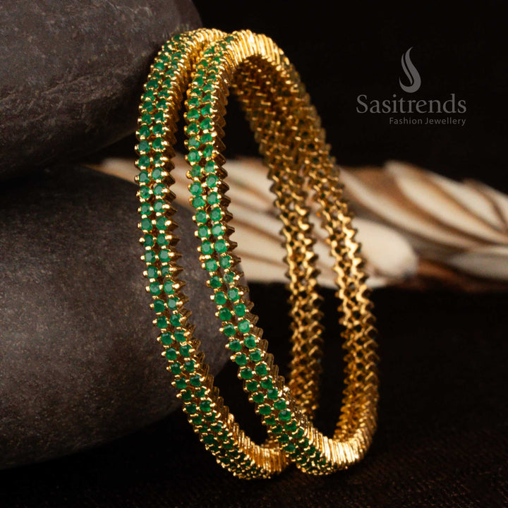 Traditional double-line green American diamond bangles in micro gold plating with a glowing finish and 1-year guarantee, perfect for festive and temple looks by Sasitrends