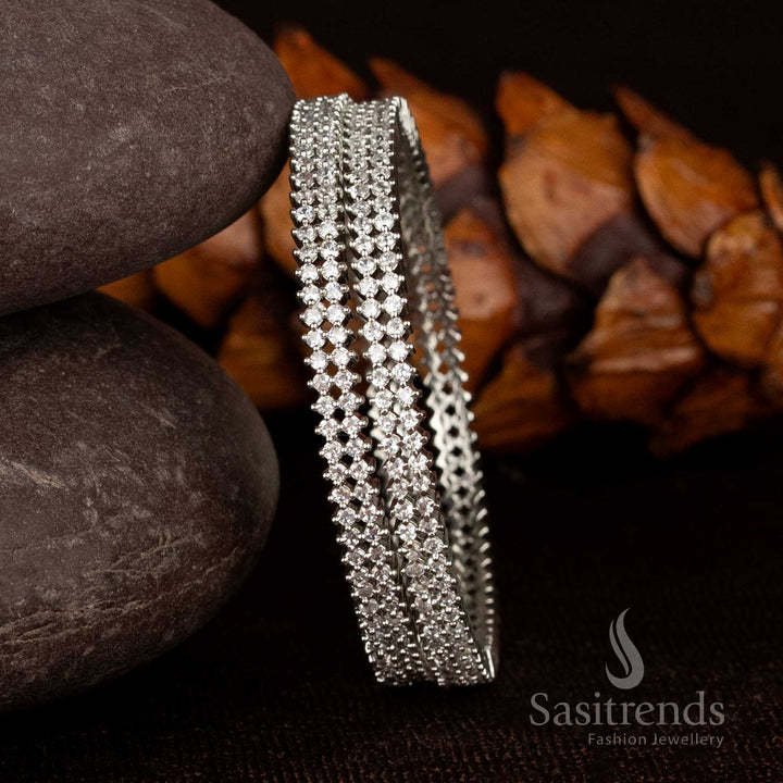 Traditional double-line white silver American diamond bangles in micro gold plating with a glowing finish and 1-year guarantee, perfect for festive and temple looks by Sasitrends