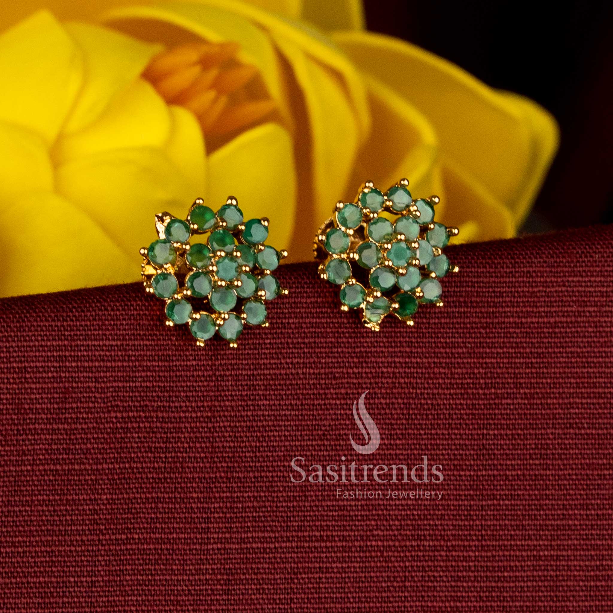 Vibrant micro gold plated AD green floral screw stud earrings with subtle leaf motifs, perfect for festive celebrations and traditional dressing with silk saree or half saree - Sasitrends