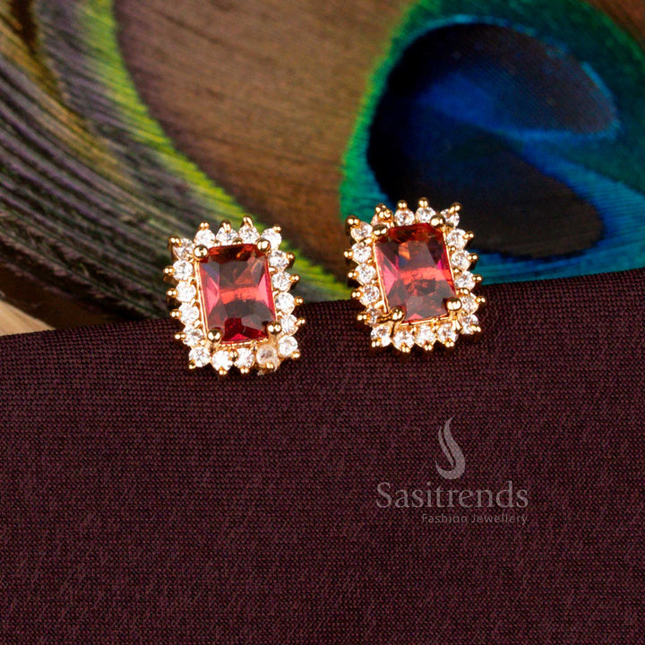 Splendid ruby-toned rectangular AD stud earrings plated with micro gold artistry glowing in 24 carat real gold look, crafted for bridal attire, temple festivals, and majestic cultural celebrations - Sasitrends