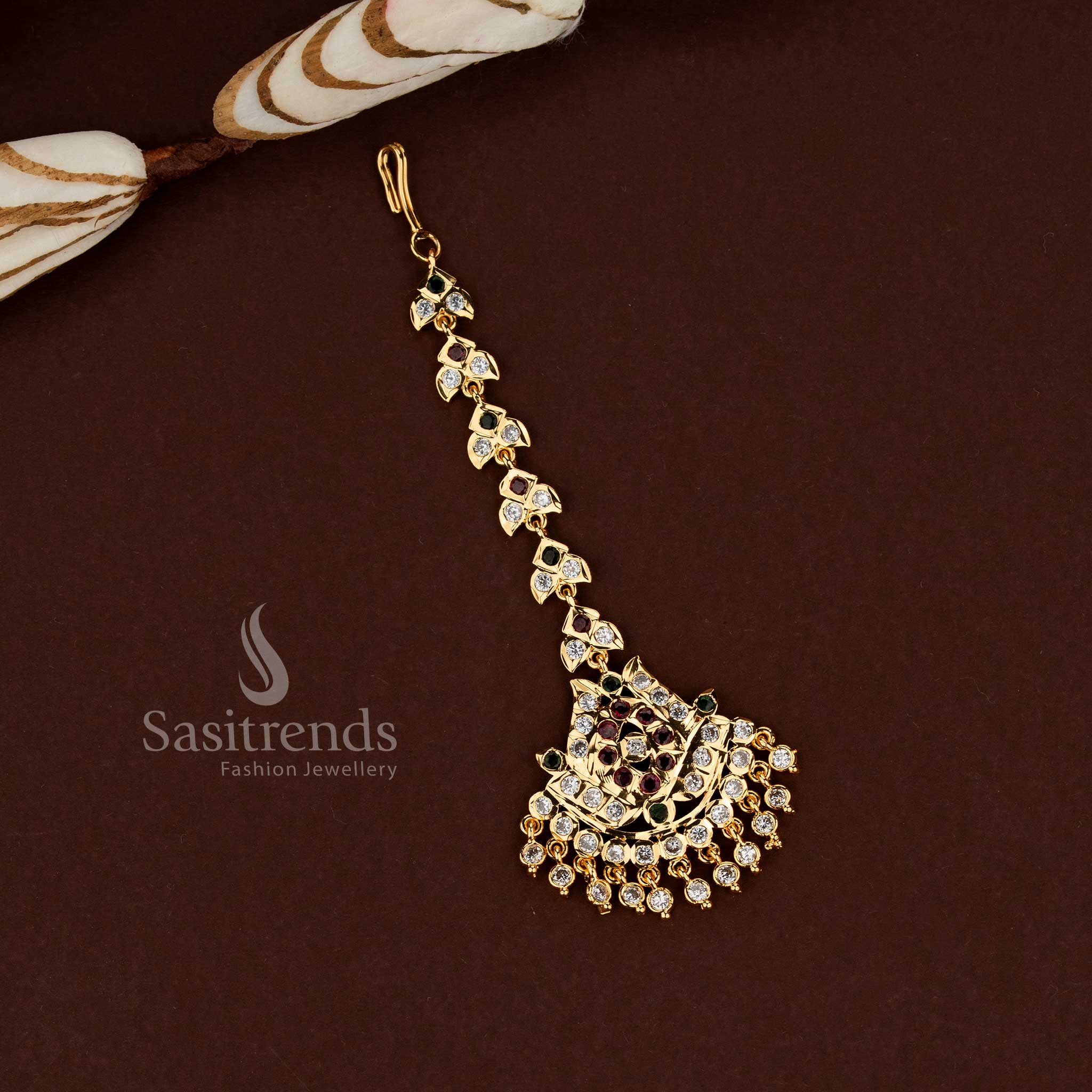 Grand multi stone lotus motif Impon micro gold plated American diamond maang tikka created for bridal elegance wedding celebrations and festive ethnic jewellery styling - Sasitrends