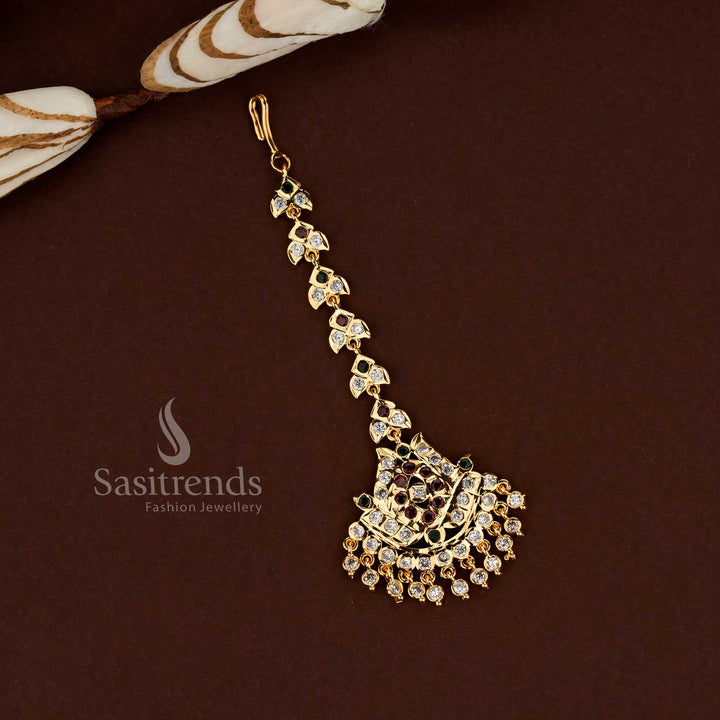 Grand multi stone lotus motif Impon micro gold plated American diamond maang tikka created for bridal elegance wedding celebrations and festive ethnic jewellery styling - Sasitrends