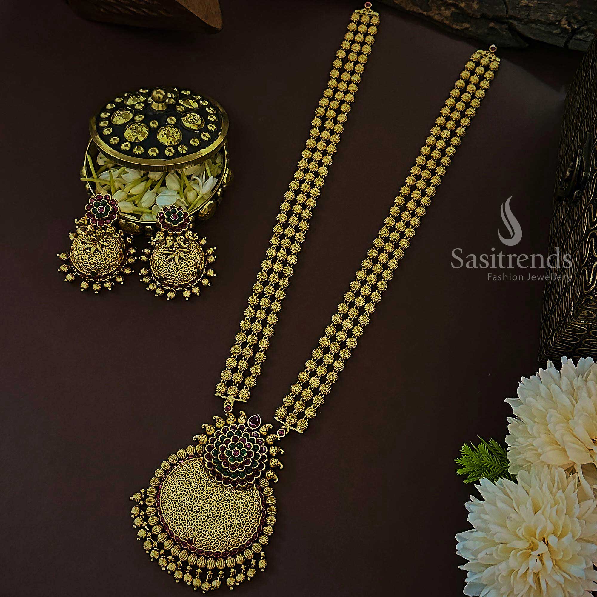 Elegant ruby-green temple matte gold long jewellery set with multi-tiered floral bead pendant and intricate jhumka design, created for bridal ceremonies that demand refined traditional grandeur – Sasitrends