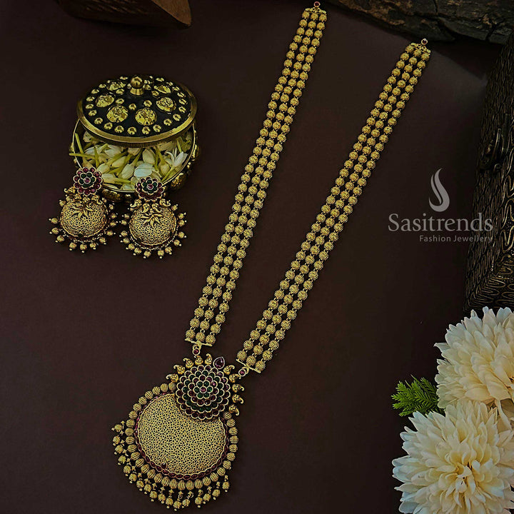 Elegant ruby-green temple matte gold long jewellery set with multi-tiered floral bead pendant and intricate jhumka design, created for bridal ceremonies that demand refined traditional grandeur – Sasitrends