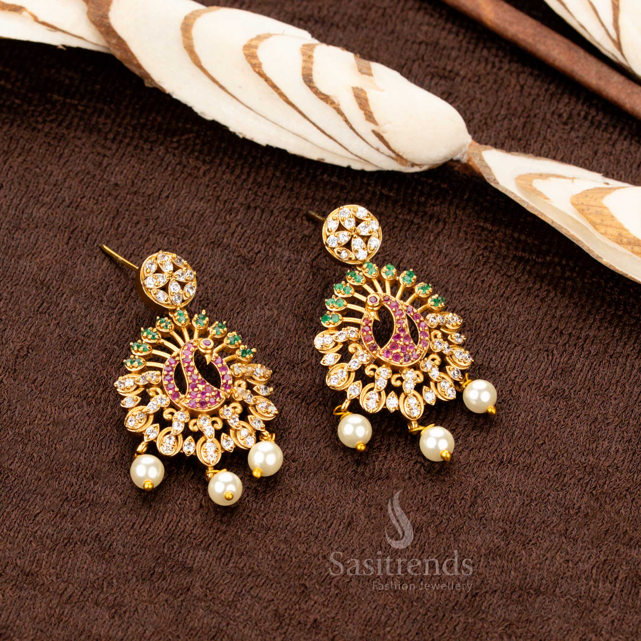 Luxurious temple-style matte gold plated Earrings  set featuring an intricately designed peacock pendant adorned with dazzling multi-color AD stones, a perfect statement piece for trendy party wear and grand festive occasions - Sasitrends