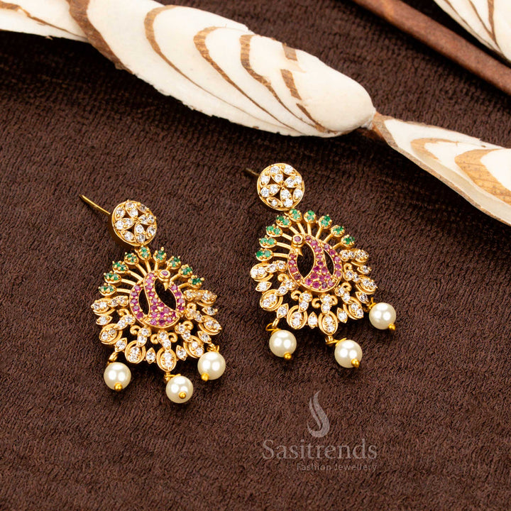 Luxurious temple-style matte gold plated Earrings  set featuring an intricately designed peacock pendant adorned with dazzling multi-color AD stones, a perfect statement piece for trendy party wear and grand festive occasions - Sasitrends