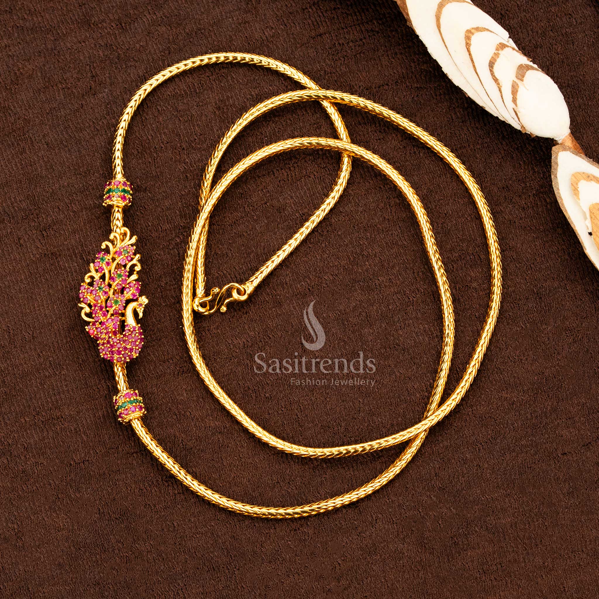 Luxurious ruby-green Peacock Mugappu Chain in one gram micro gold polish, embellished with sparkling AD stones and intricate bird motifs – a regal ethnic bridal jewellery neckpiece designed for traditional celebrations – Sasitrends