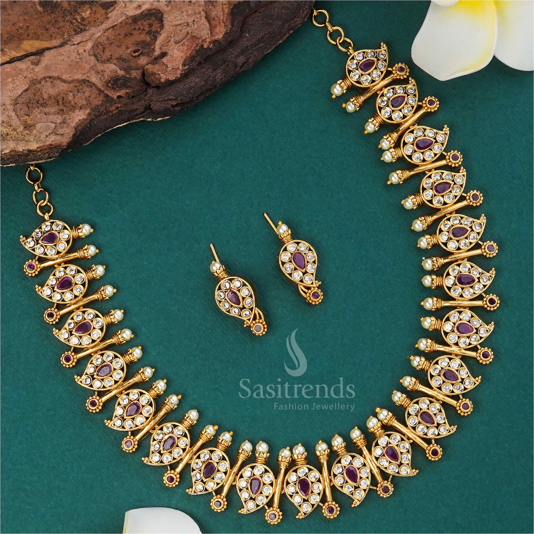 Elegant white-ruby temple matte gold necklace featuring detailed mango and stick motifs, embellished with sparkling AD stones for traditional wedding wear - Sasitrends