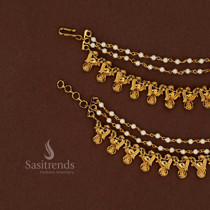 Majestic Lakshmi temple matte gold plated American diamond matils embellished with ruby and green stones finished with refined pearl accents for bridal splendour - Sasitrends