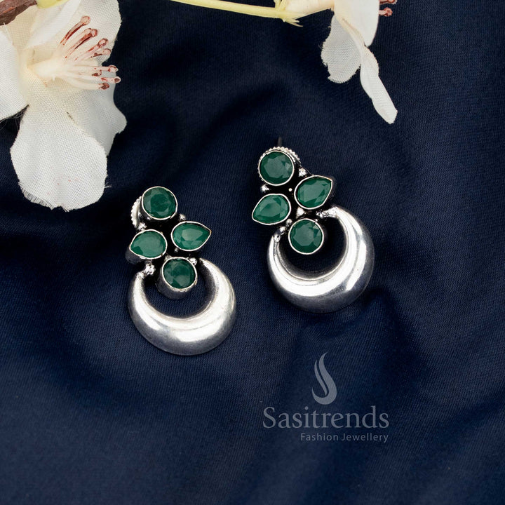 Charming green oxidised half moon floral motif earrings designed for ethnic saree wear, radiating Navaratri splendour and artistic craftsmanship by Sasitrends