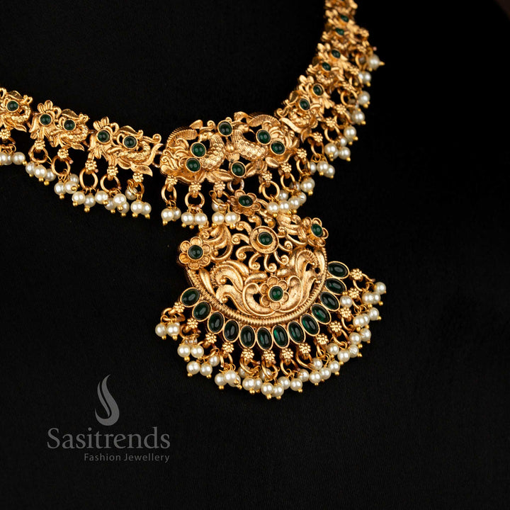 Classic Peacock Matte Gold Plated Necklace Jewellery Set with Artistic Floral Motifs and Matching Jhumkas in Rich Green, Ideal for Bridal Wear – Sasitrends