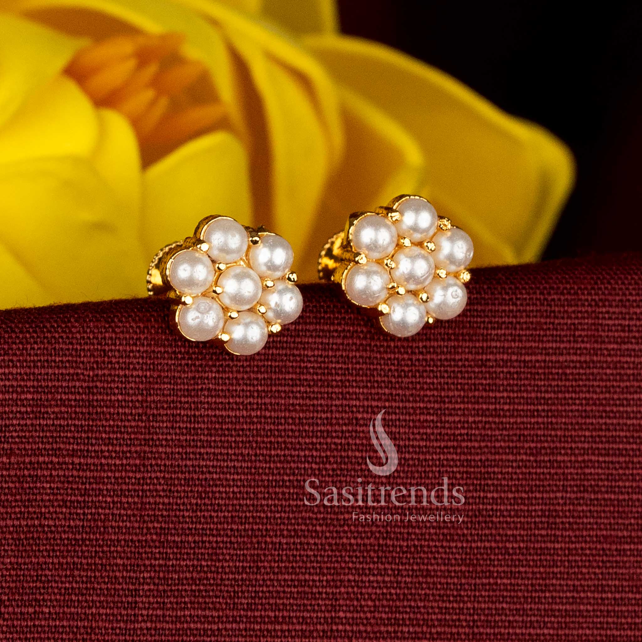 Premium one gram micro gold plated AD floral stud earrings showcasing lustrous pearl tones and a polished radiant look ideal for saree styling – Sasitrends
