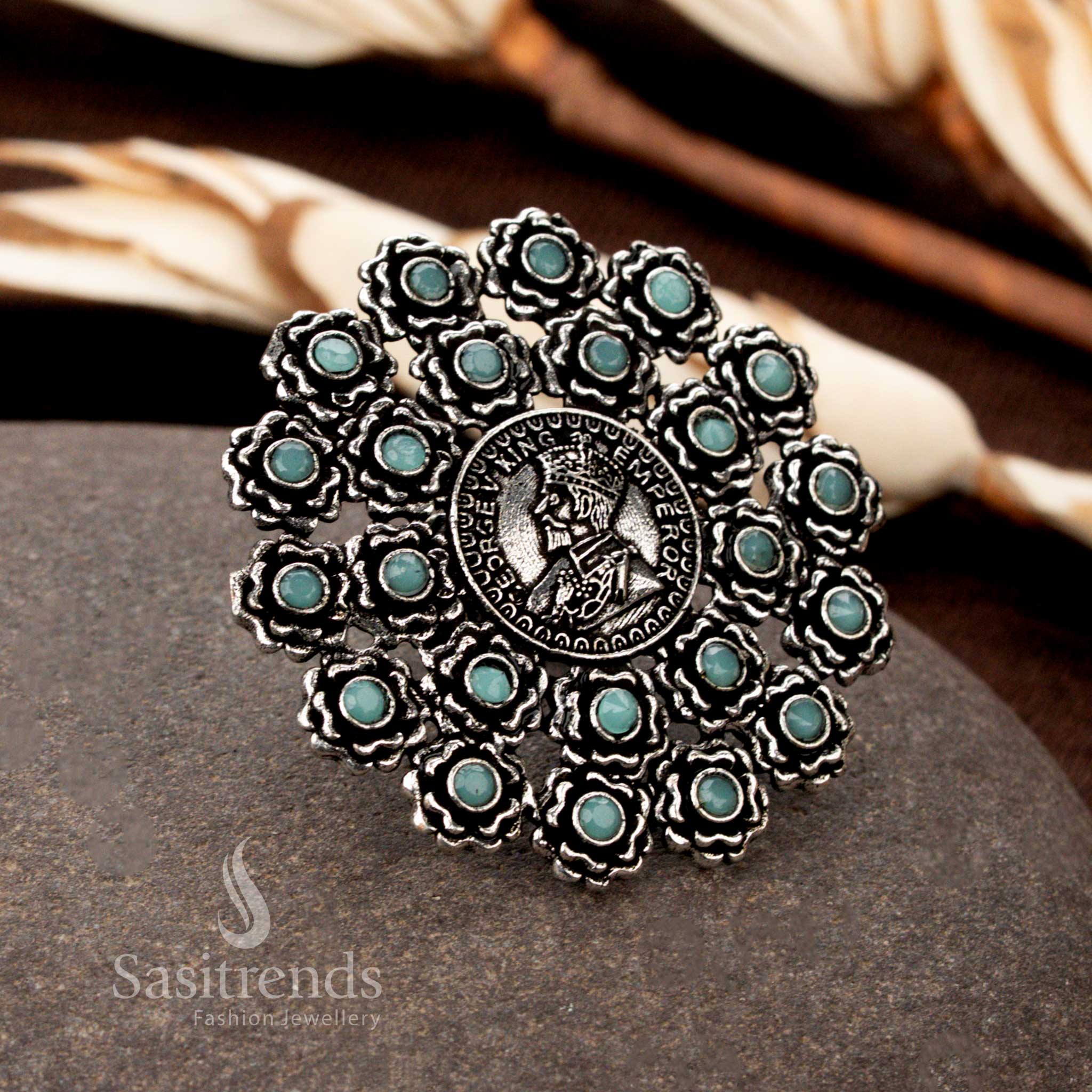 A refreshing oxidised floral coin ring with exquisite handcrafted details, featuring a soft Sky-Blue stone accent for a subtle yet striking look - Sasitrends