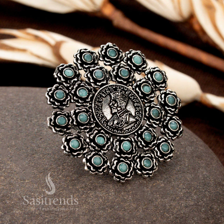 A refreshing oxidised floral coin ring with exquisite handcrafted details, featuring a soft Sky-Blue stone accent for a subtle yet striking look - Sasitrends