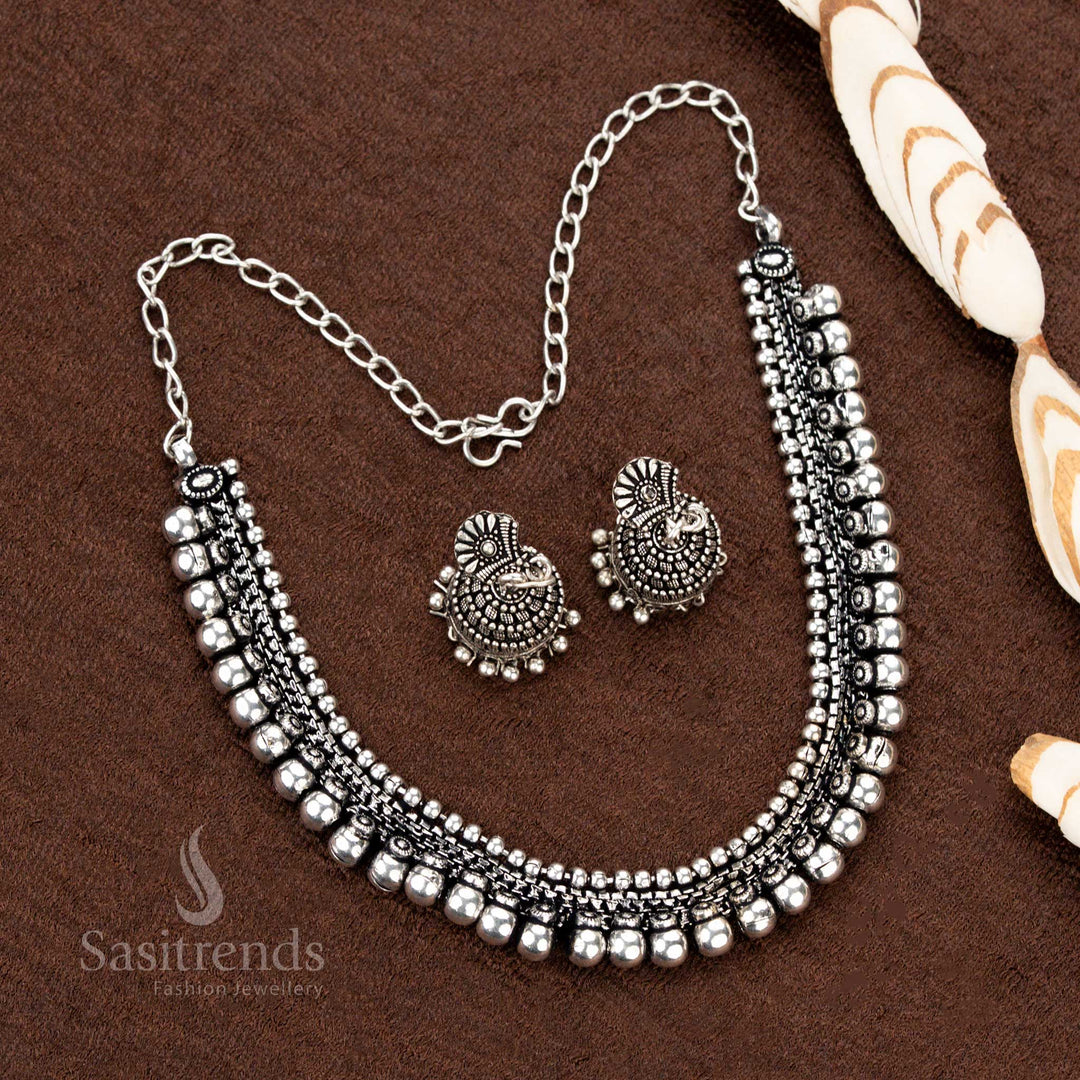 Graceful oxidised silver toned traditional necklace set featuring dual ball rows and floral stud earrings, a stunning ethnic jewellery piece for Navaratri, saree styling, and festive occasions - Sasitrends
