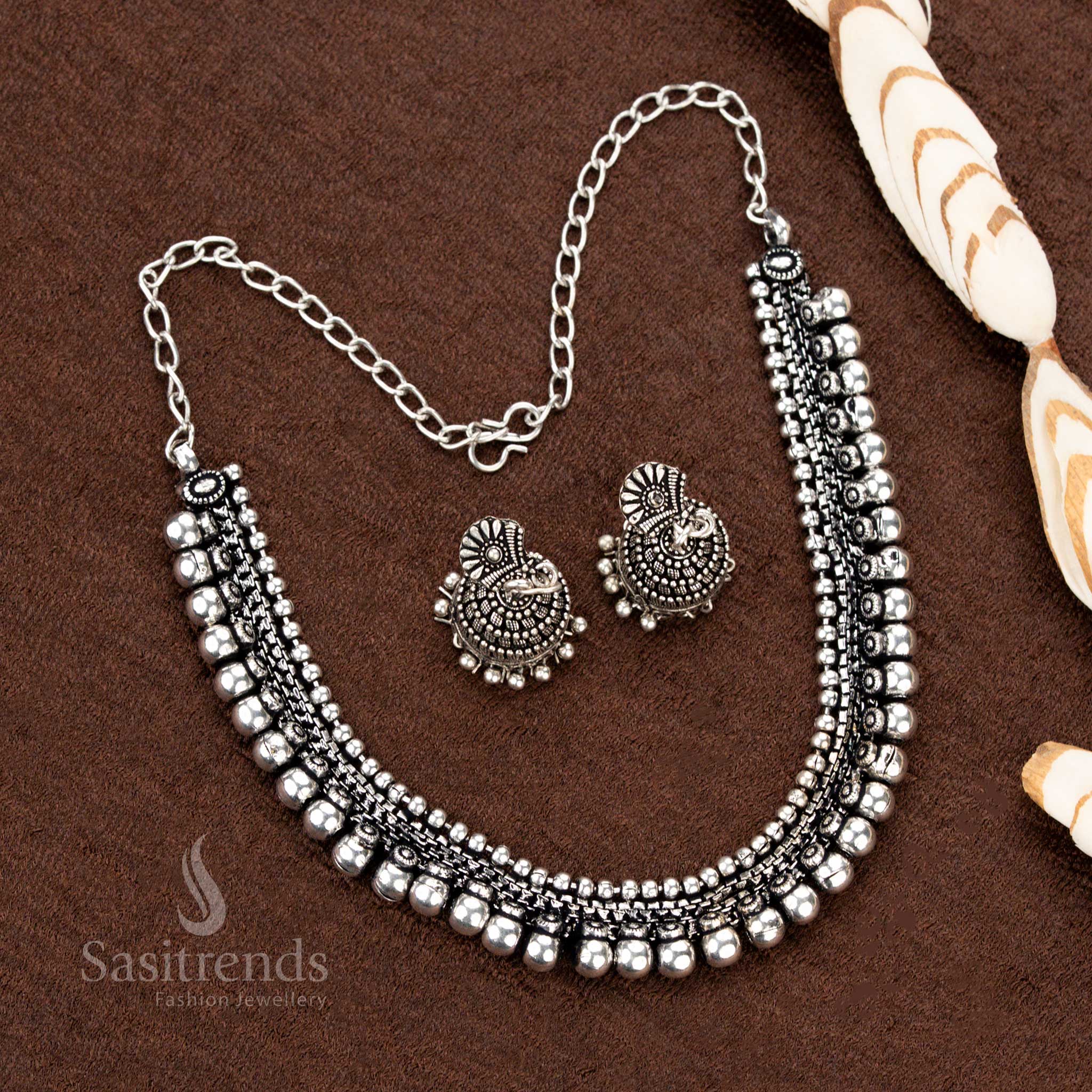 Graceful oxidised silver toned traditional necklace set featuring dual ball rows and floral stud earrings, a stunning ethnic jewellery piece for Navaratri, saree styling, and festive occasions - Sasitrends