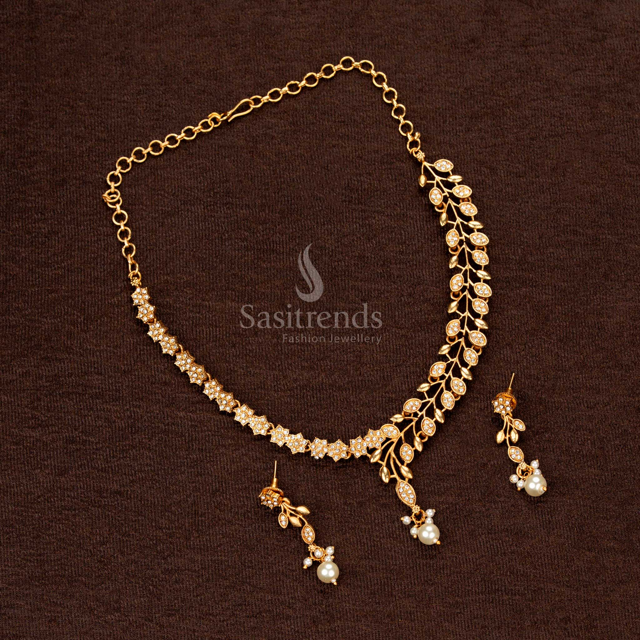 Traditional temple-style necklace with asymmetric leaf vine detailing and pearl accent - Sasitrends