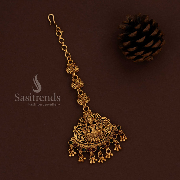 Traditional classic matte gold plated ruby green Lakshmi motif maang tikka with hanging balls - Sasitrends
