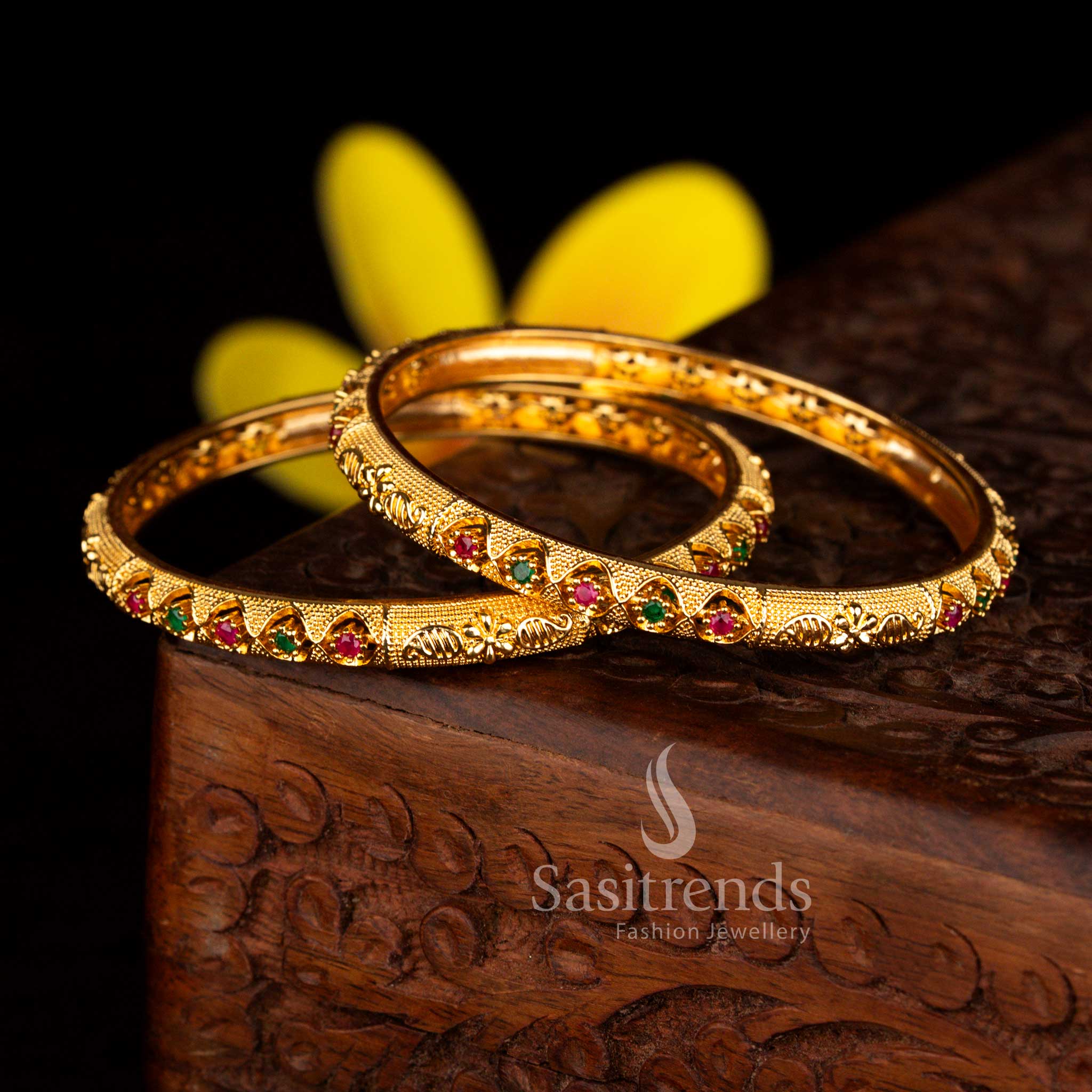 Traditional micro gold plated paisley floral bangles set of 2 featuring sparkling AD stones in ruby-green shade for elegant saree wear – Sasitrends