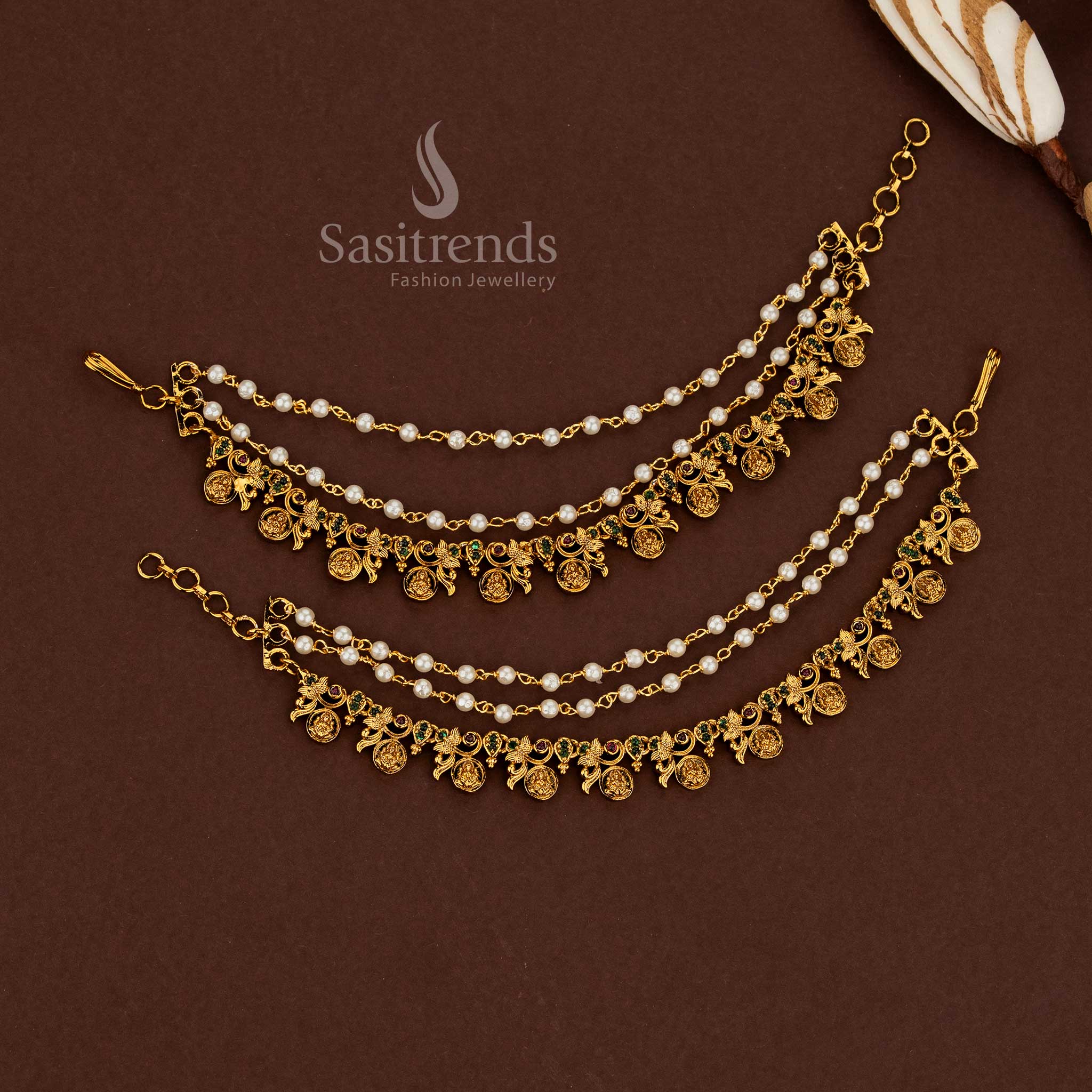 Intricately detailed Lakshmi temple matte gold plated American diamond matil ear chains featuring ruby-green stone harmony and pearl embellishments for wedding wear - Sasitrends