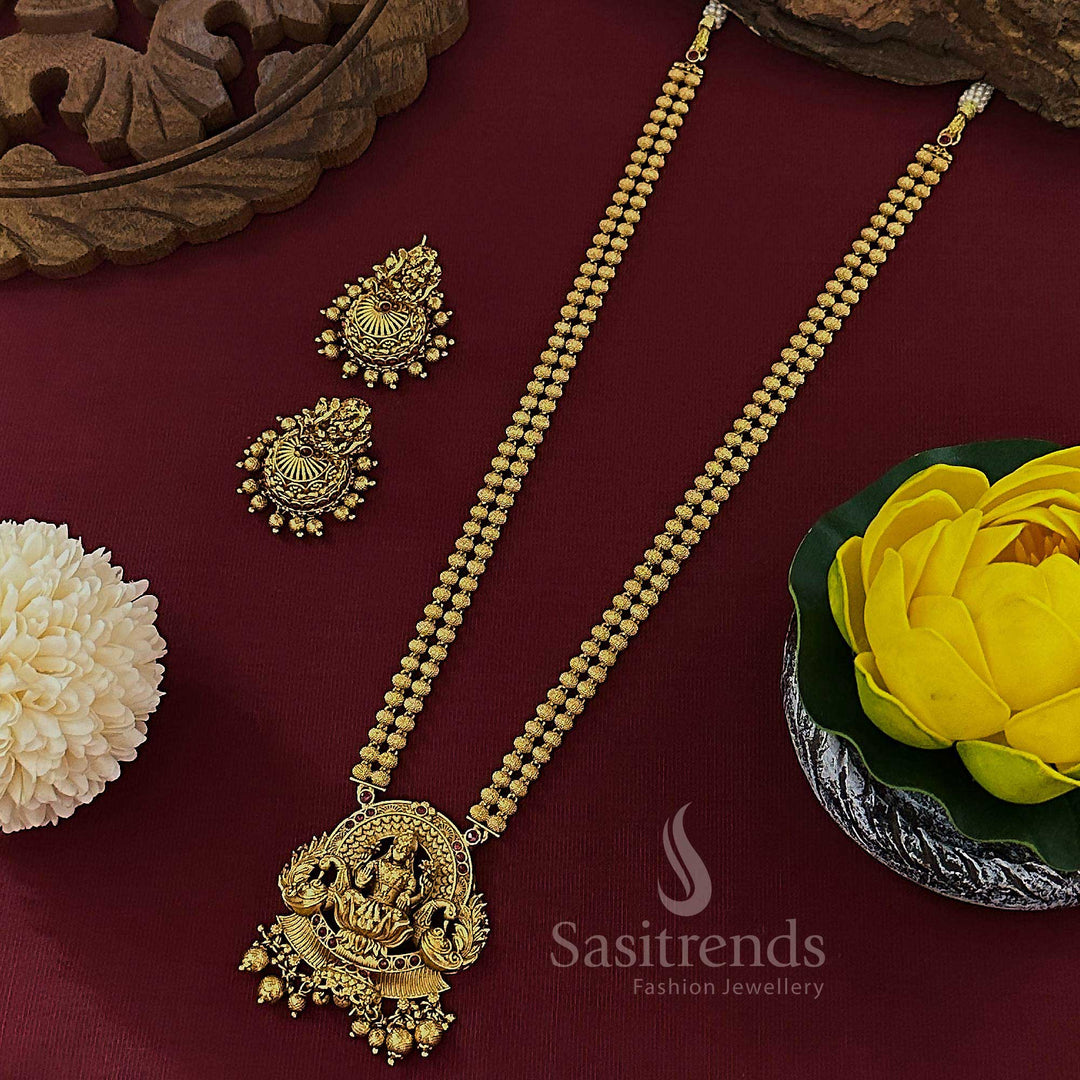 Bridal matte gold plated Lakshmi peacock pendant double layer bead long haram with ruby stones and antique finish jhumkas, perfect for divine South Indian wedding jewellery looks – sasitrends