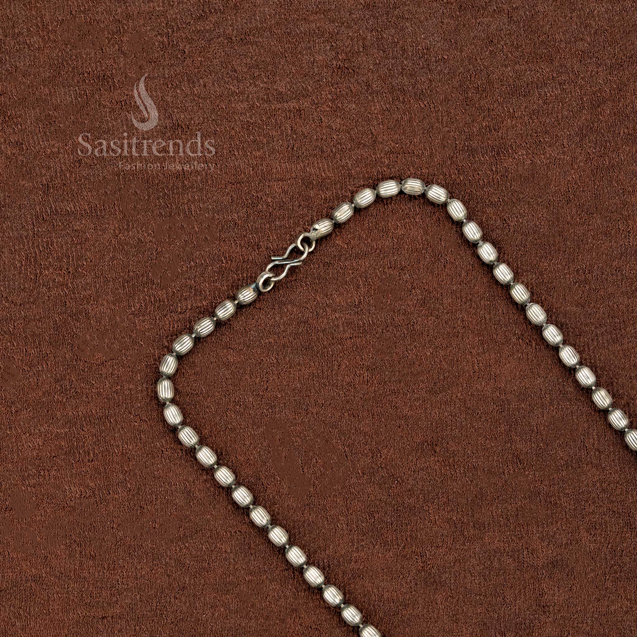 Tribal-style oxidised silver necklace with floral pendant and engraved links, ideal for ethnic weddings and cultural wear – Sasitrends