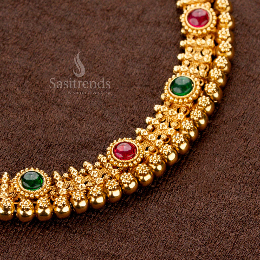 Antique gold plated necklace set studded with ruby and green AD stones, featuring bold bead rows and circular motifs, perfect for festive and traditional attire - Sasitrends